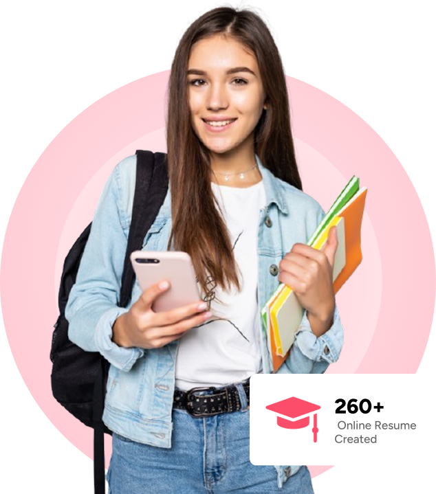 A smiling female student holding books